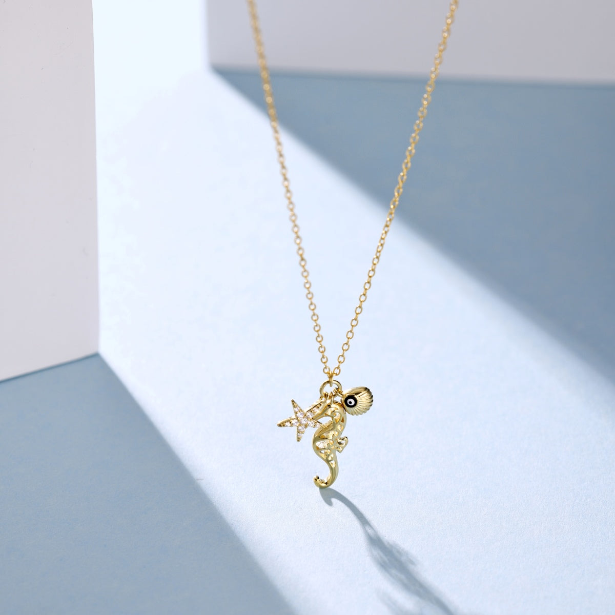 Summer Ocean Series: S925 Silver 18K Yellow Gold Plated Necklace with White Zircon Starfish, Seahorse, Hollow Shell, and Evil Eye Design