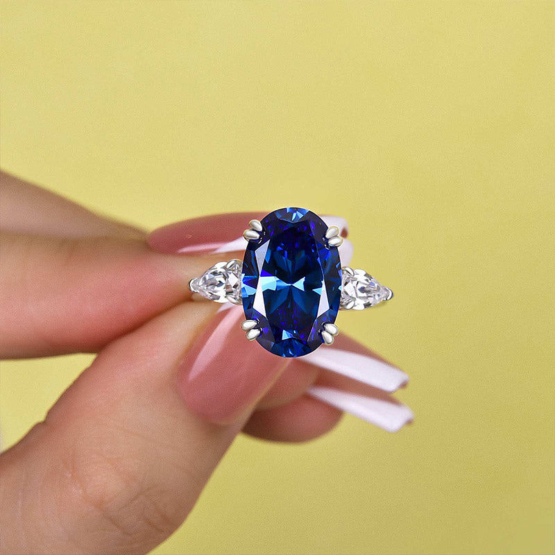 Gorgeous Oval Cut Blue Sapphire Three Stone Engagement Ring In Sterling Silver