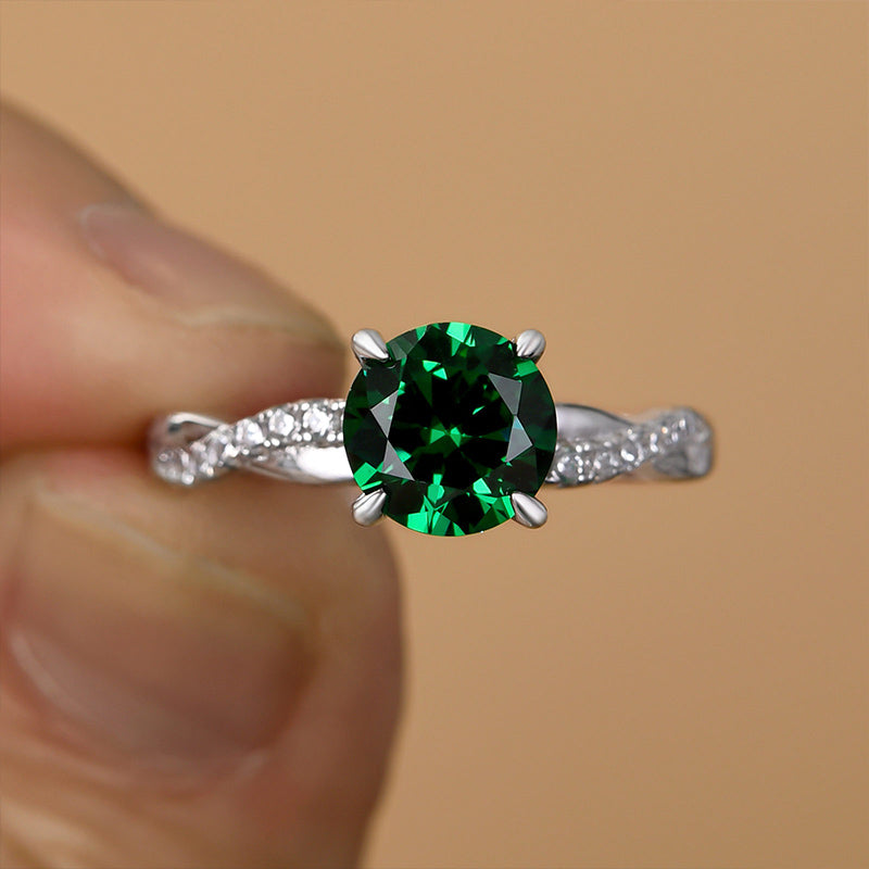 Twist Round Cut Emerald Green Engagement Ring In Sterling Silver