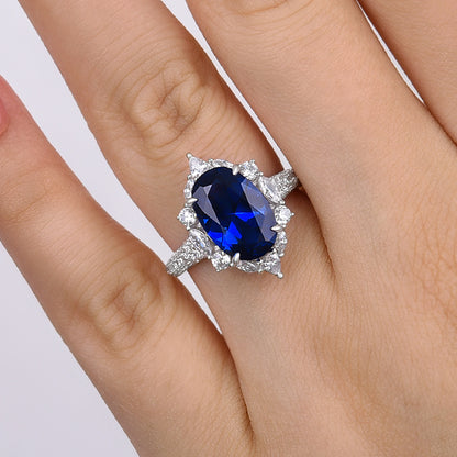 Gorgeous Halo Split Shank Oval Cut Blue Sapphire Engagement Ring In Sterling Silver