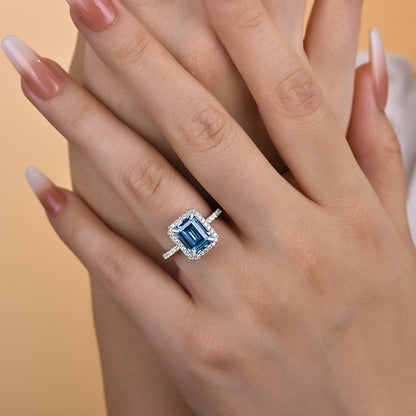 Halo Emerald Cut Light Aquamarine Blue Engagement Ring In Sterling Silver