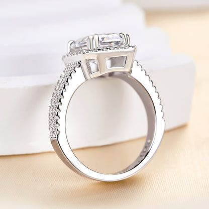 Excellent Halo Three Shank Emerald Cut Engagement Ring In Sterling Silver