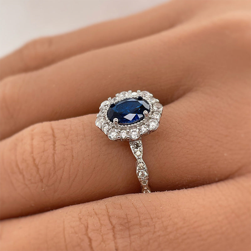 Noble Halo Oval Cut Blue Sapphire  Engagement Ring In Sterling Silver