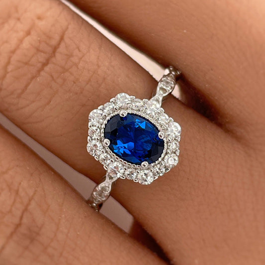 Noble Halo Oval Cut Blue Sapphire  Engagement Ring In Sterling Silver