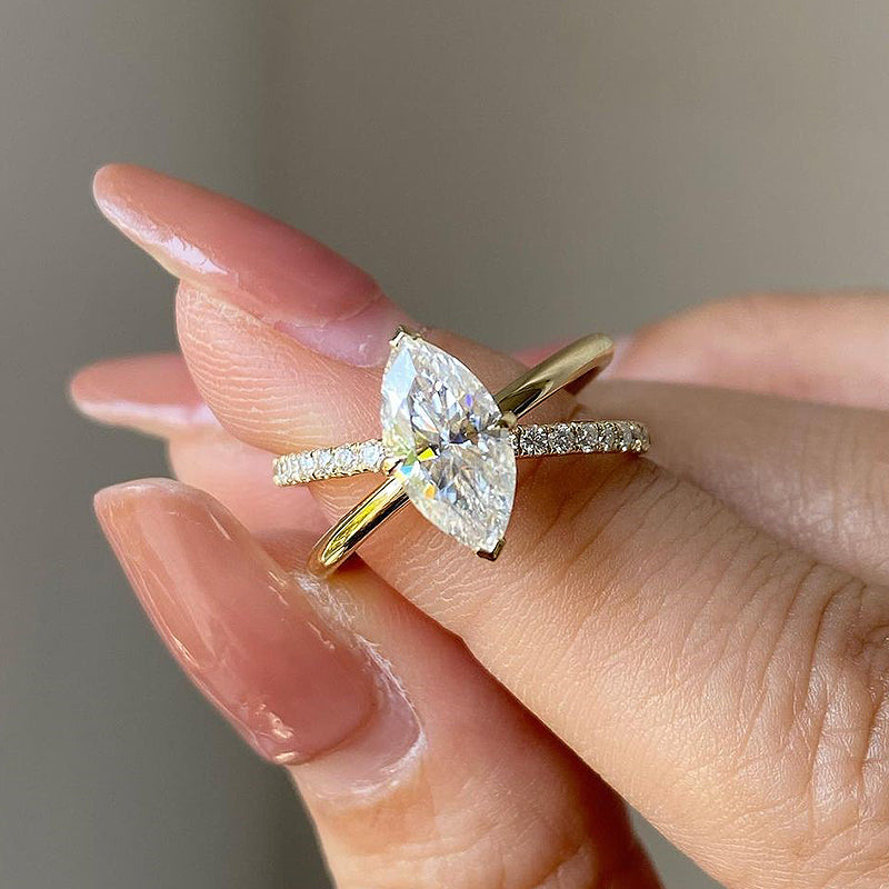 Unique Yellow Gold Cross Shank Marquise Cut Engagement Ring