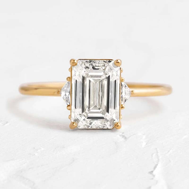 Dainty Three Stone Yellow Gold Emerald Cut Engagement Ring