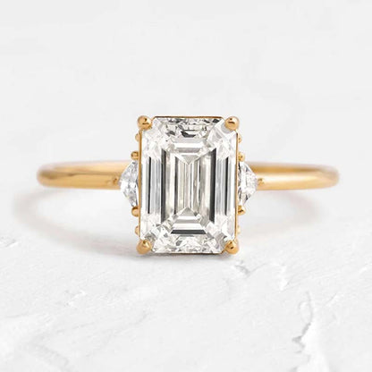 Dainty Three Stone Yellow Gold Emerald Cut Engagement Ring