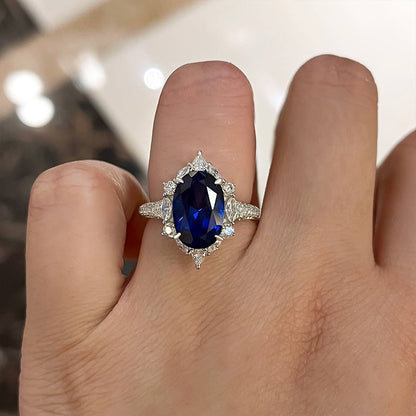 Gorgeous Halo Split Shank Oval Cut Blue Sapphire Engagement Ring In Sterling Silver-Maxinejewelry