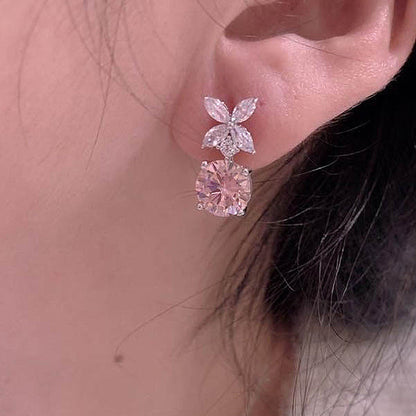 Elegant Round Cut Pink Sapphire Stud Earrings In Sterling Silver