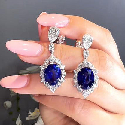 Luxurious Halo Oval Cut Blue Sapphire Women's Earrings In Sterling Silver-Maxinejewelry